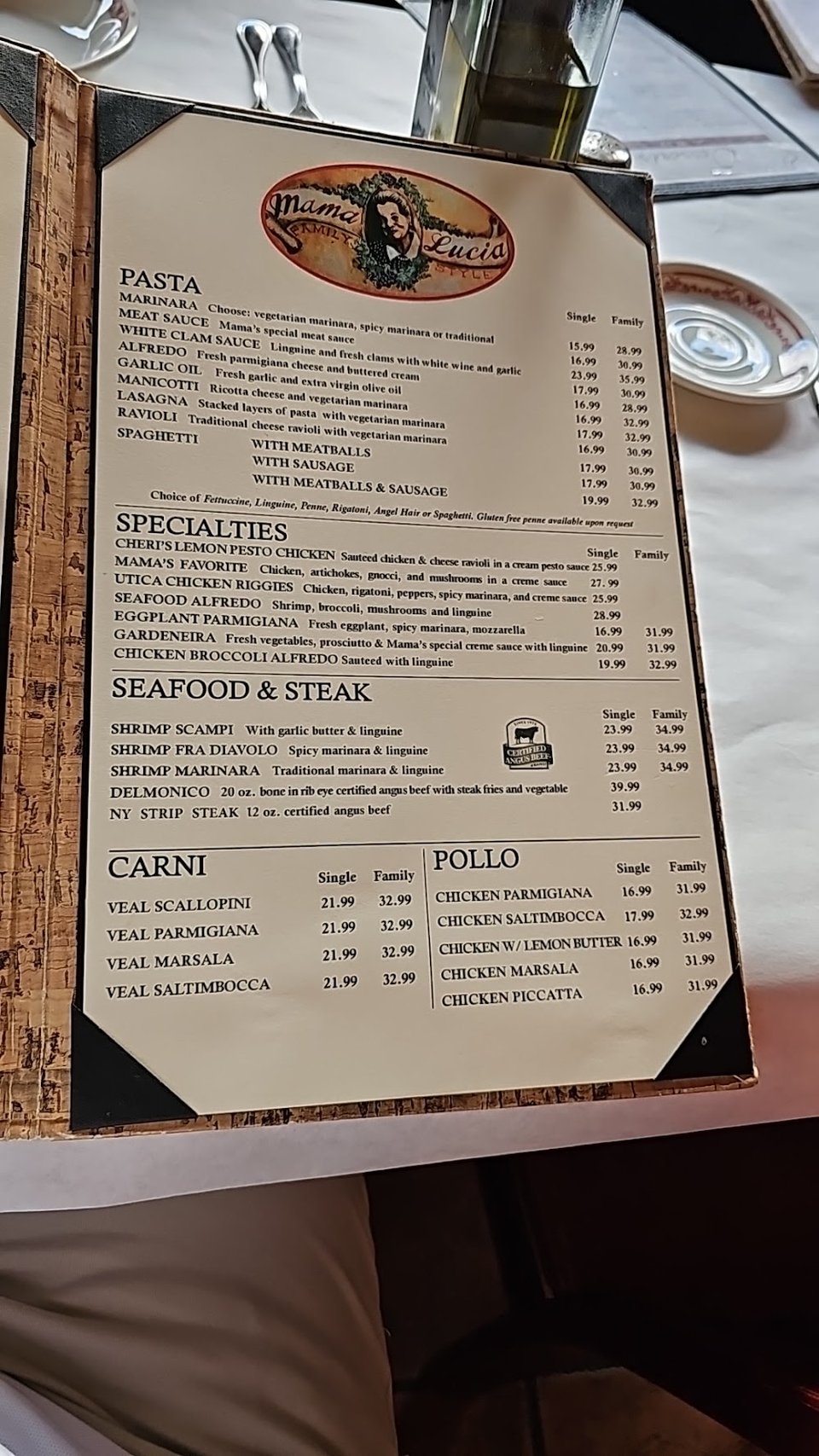 Printed menu with Italian dishes listed.