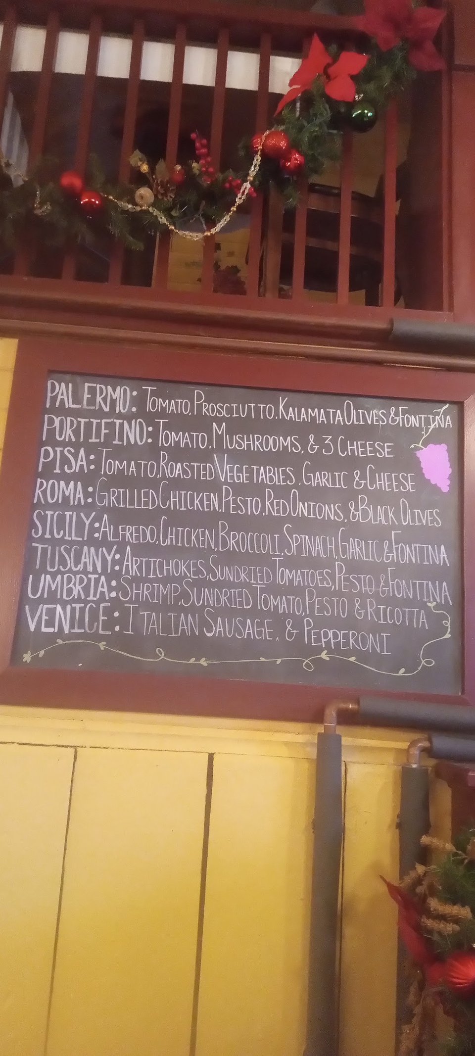Close-up of menu sections and dish names.